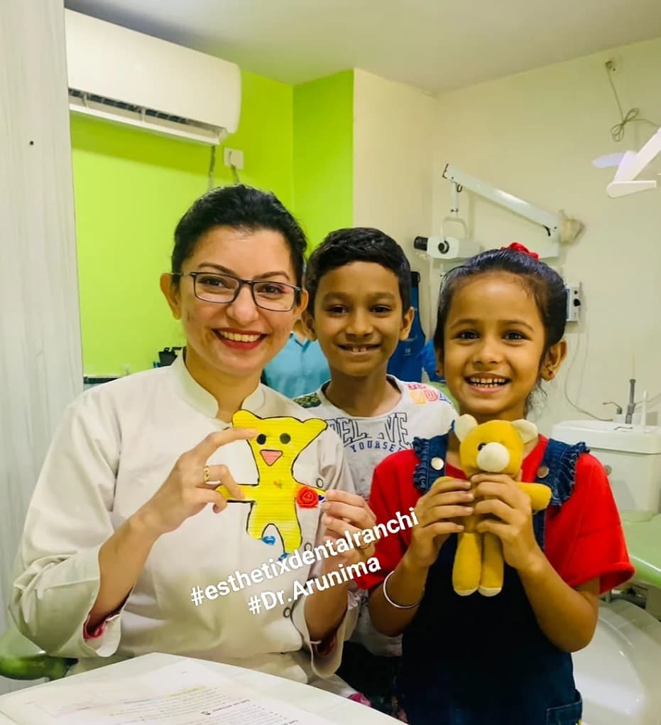 Happy child patient with Dr Arunima